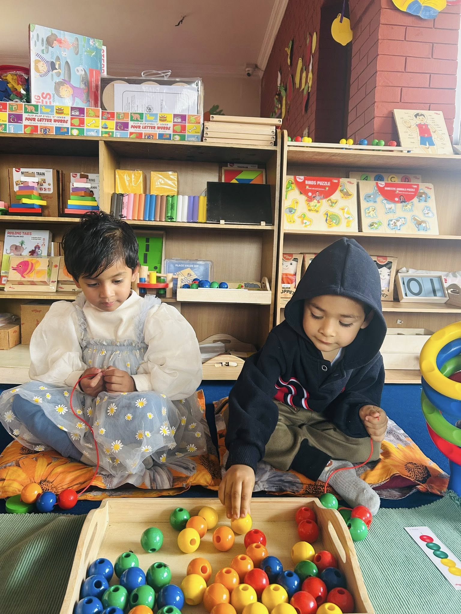 Kids playing group games EuroKids Mulpani Kathmandu school
